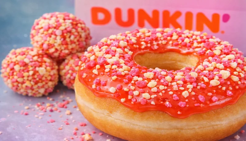 Dunkin fruit punch donut and munchkins with colorful sprinkles